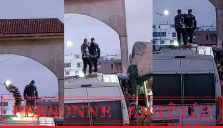 فيديو شخص يعتلي سيارة الشرطة.. الأمن يتدخل بحزم