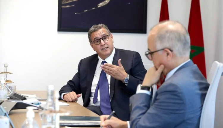 شكيب بنموسى وعزيز أخنوش