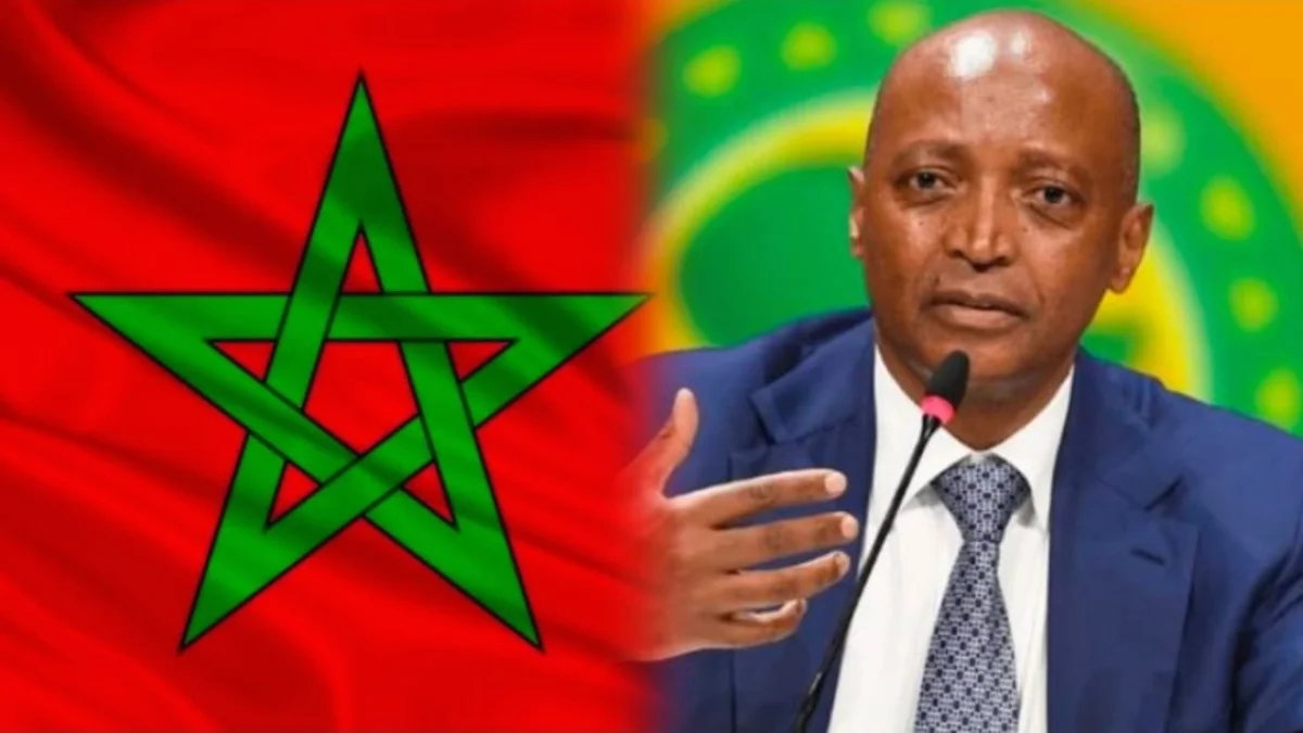 رئيس الكاف وعلم المغرب