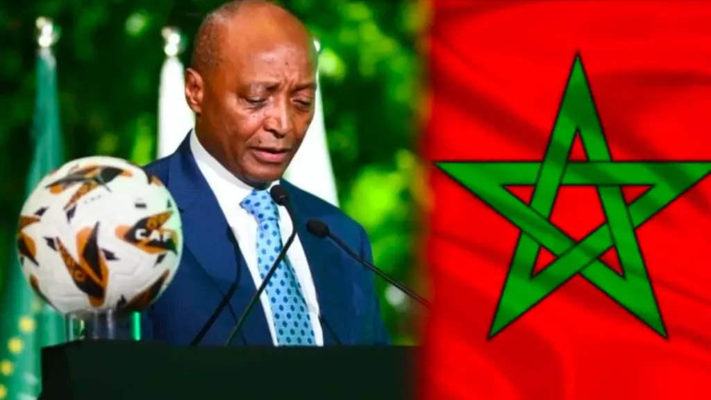 رئيس الكاف وعلم المغرب