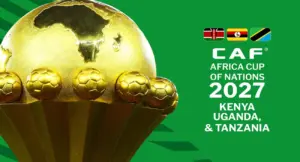 كأس أمم إفريقيا الذهبية بجانب شعار CAF لنسخة 2027 التي تستضيفها كينيا وأوغندا وتنزانيا، مخصصة لاستعراض مواعيد الافتتاح والنهائي